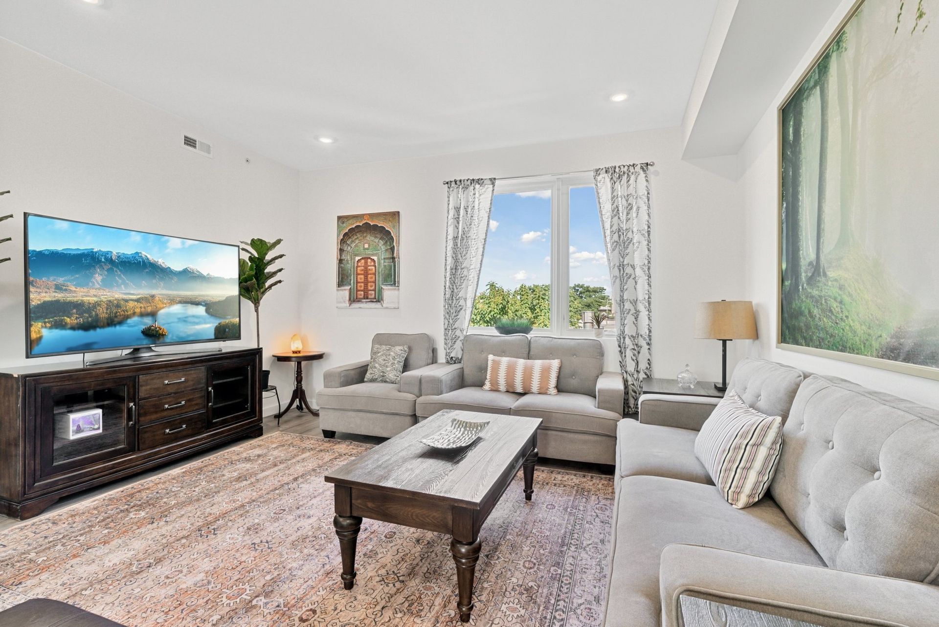 A living room filled with furniture and a flat screen tv.