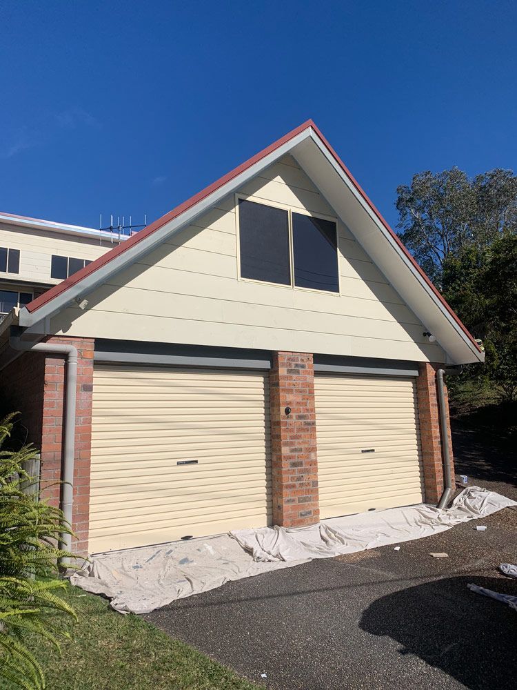 Cream Coloured Garage Doors — House Painting in Forster