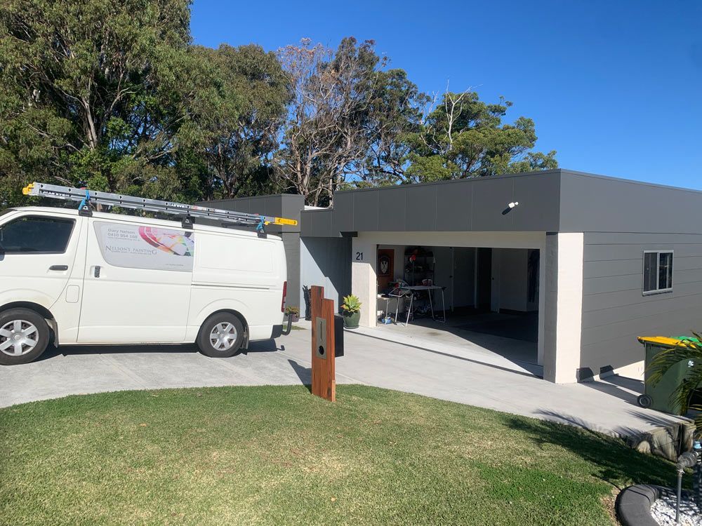 Service Van Parked in Front of Garage — House Painting in Forster