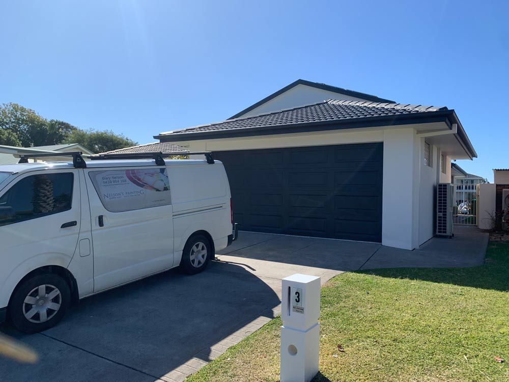 Vehicle in Front of Garage — Painting in Forster