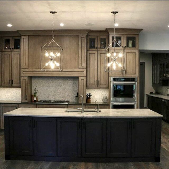 A kitchen with a large island and lots of cabinets