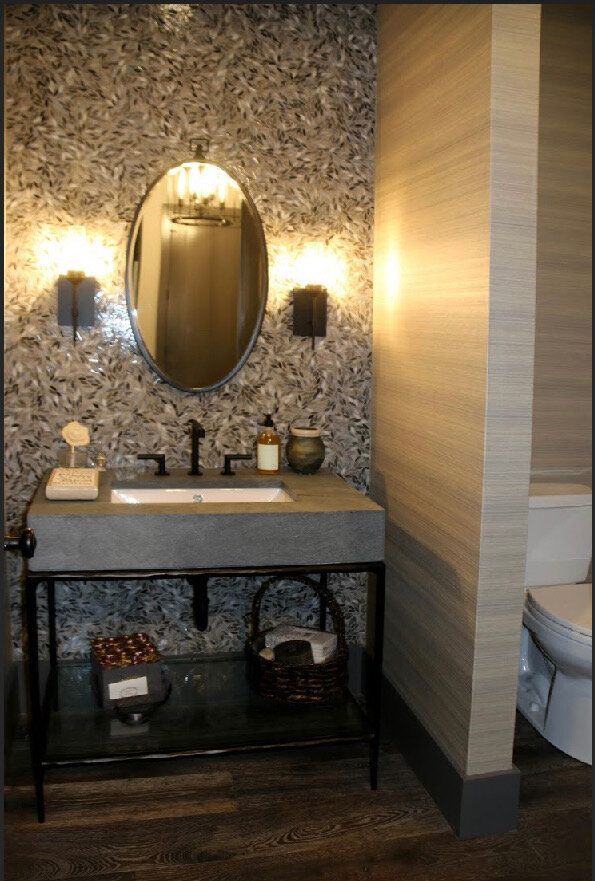 A bathroom with a sink a mirror and a toilet