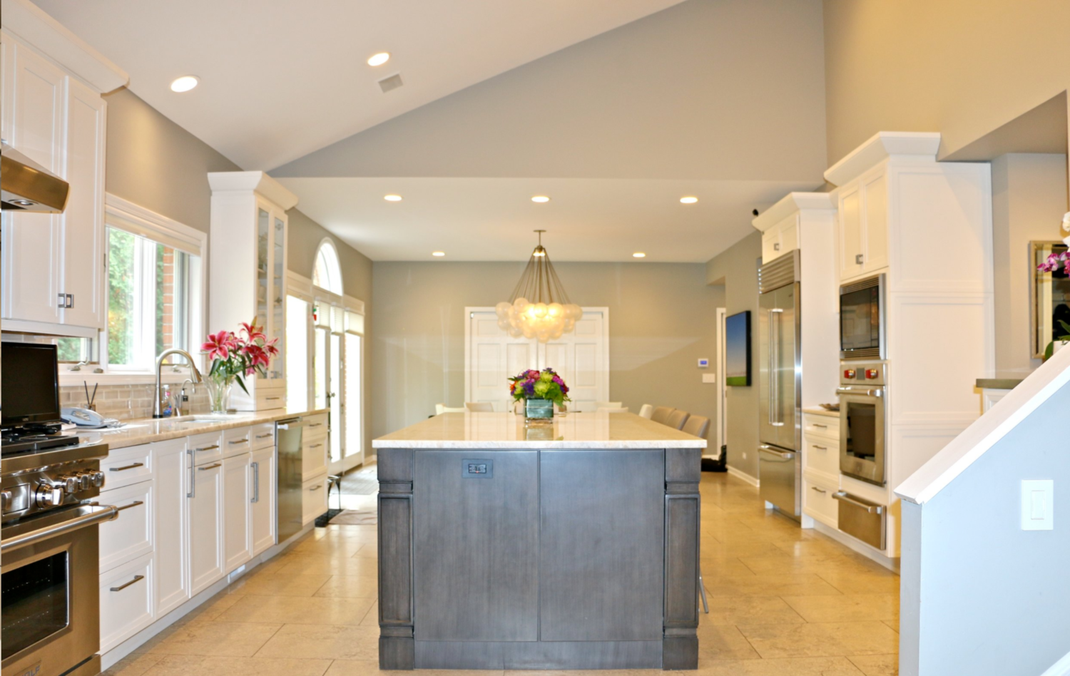 A kitchen with a large island in the middle of it