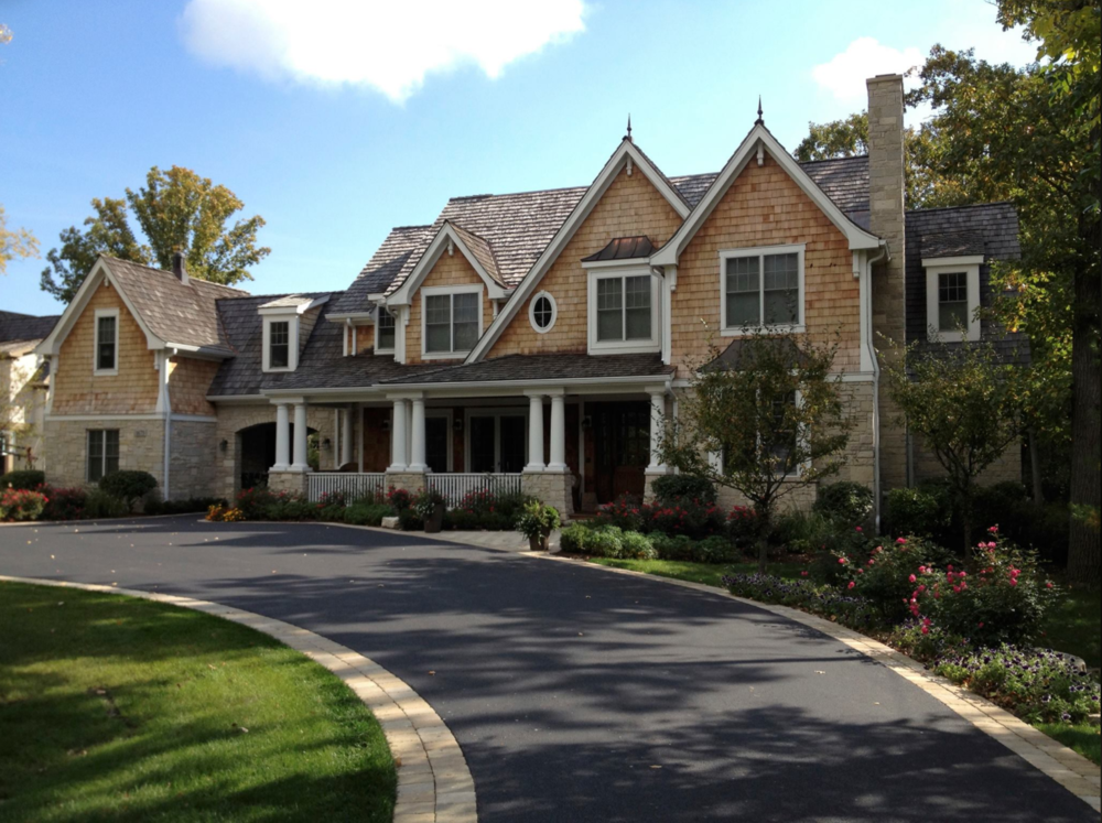 A large house with a driveway leading to it