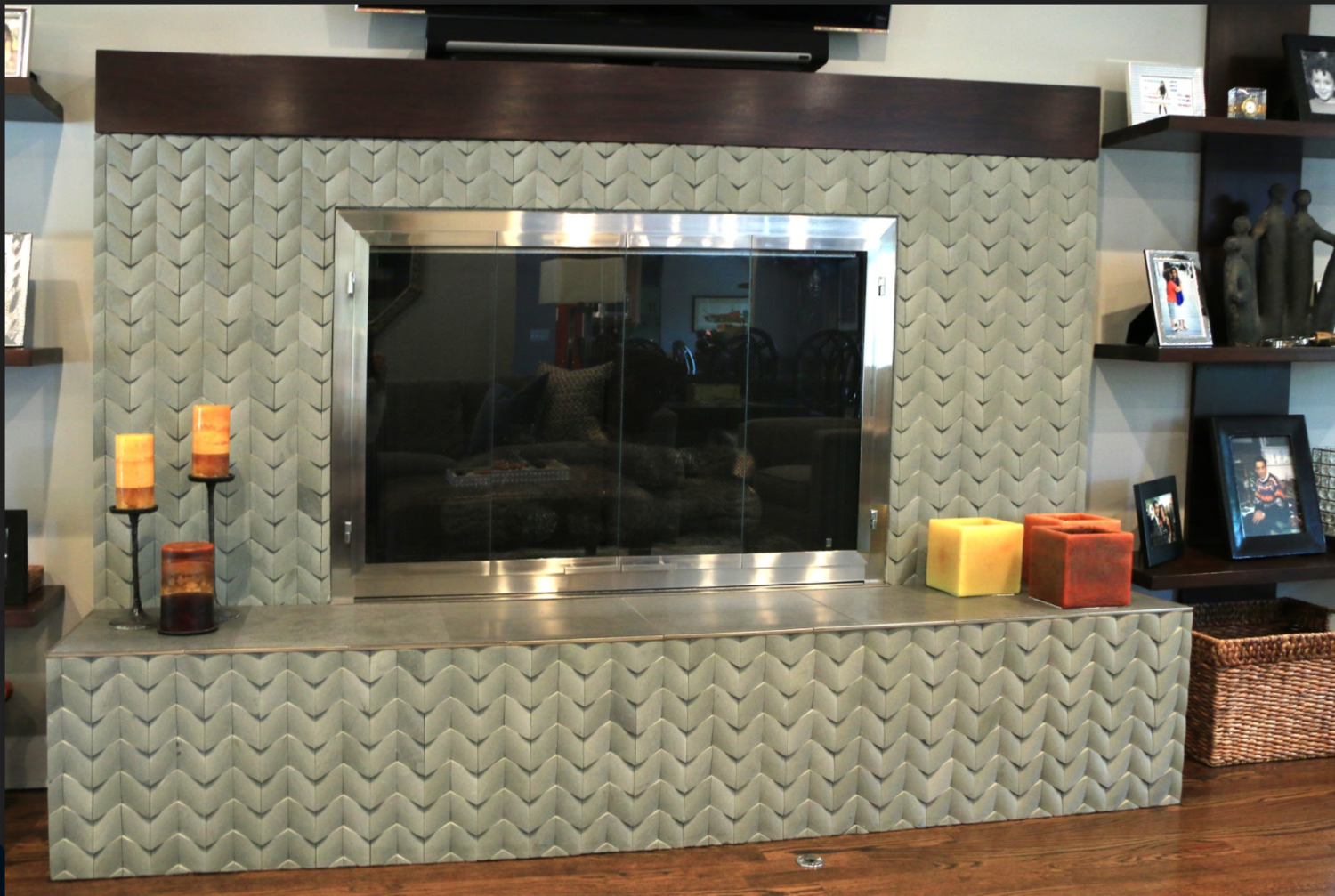 A living room with a fireplace and a television