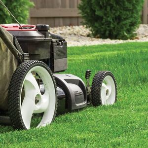 Lawn Mower on the Green Grass — Pleasant Hill, MO — Branched Out LLC