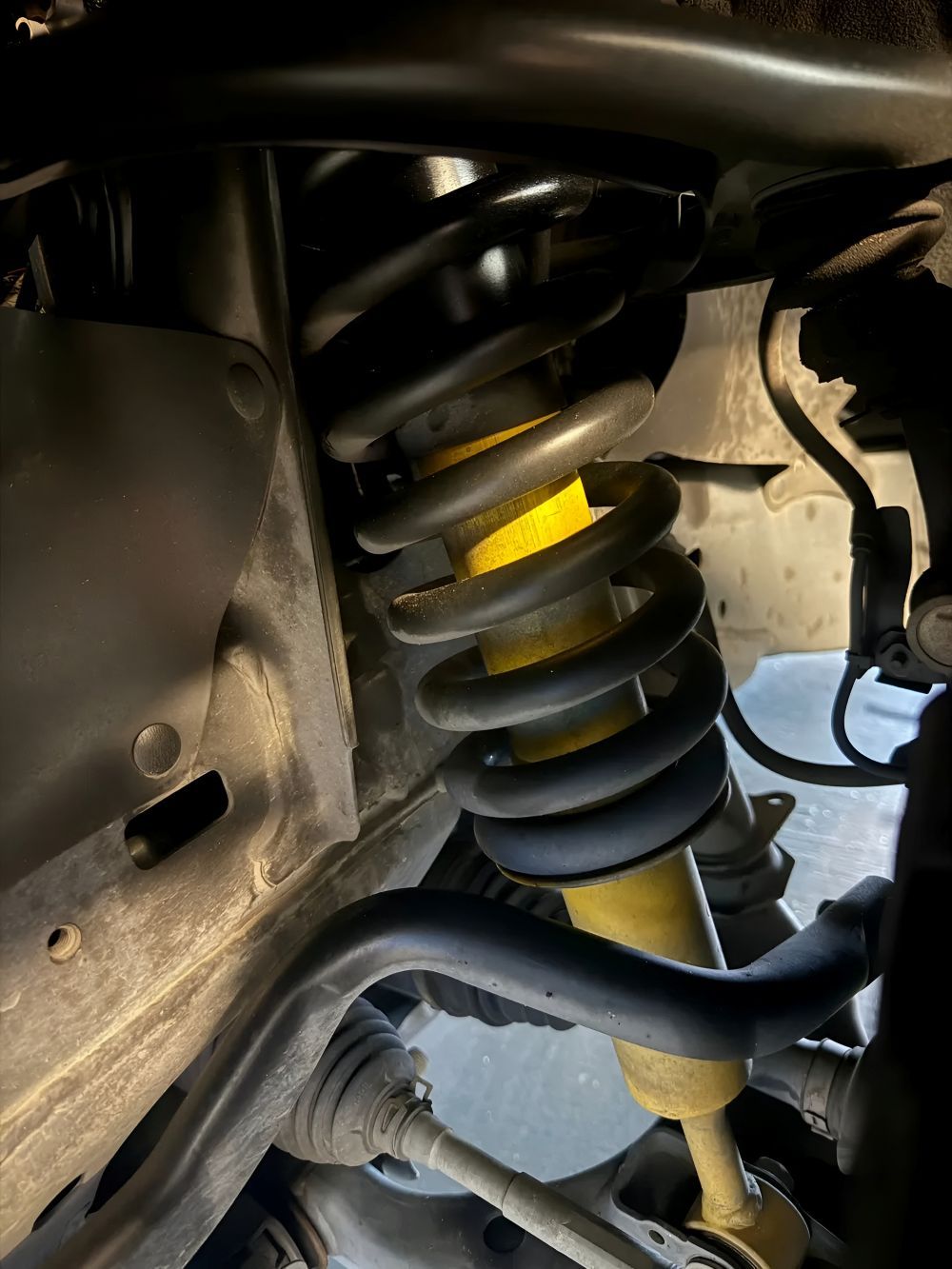 Yellow Shock Absorber and Coil Spring — Triple C Workshop in Springwood, QLD