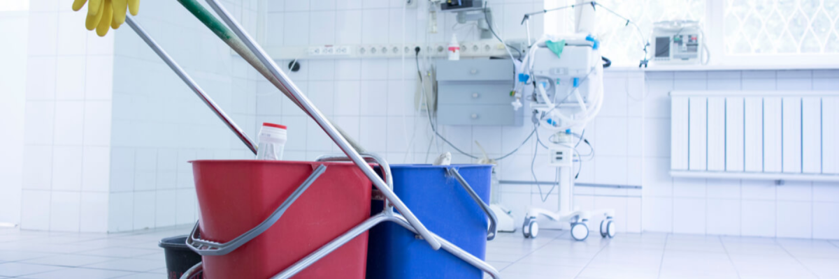 mop or cleaner buckets on a cart in a hospital room