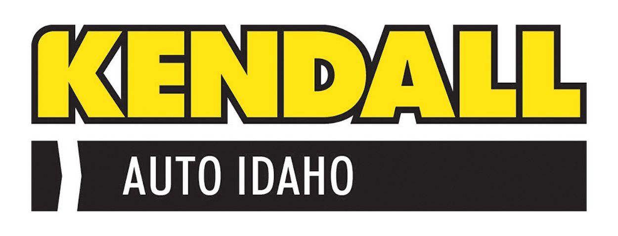 The logo for kendall auto idaho is yellow and black.
