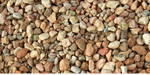 a pile of pea gravel of different sizes and colors on a white background .