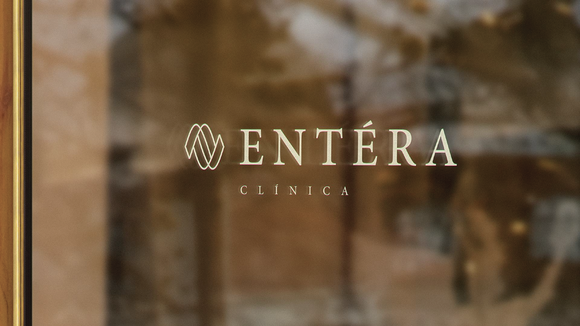 A glass door with the word entera on it