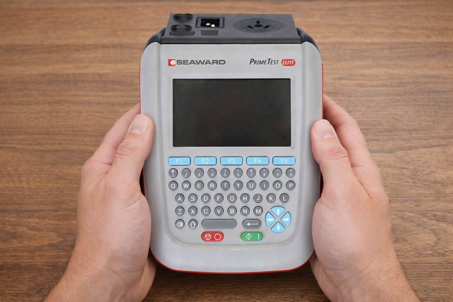 Person holding an electrical test and tag device