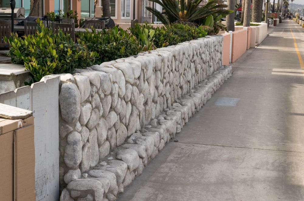 Stone Wall With Built-in Bench on a Sidewalk Next to a Street — Capital Fencing in Belconnen, ACT