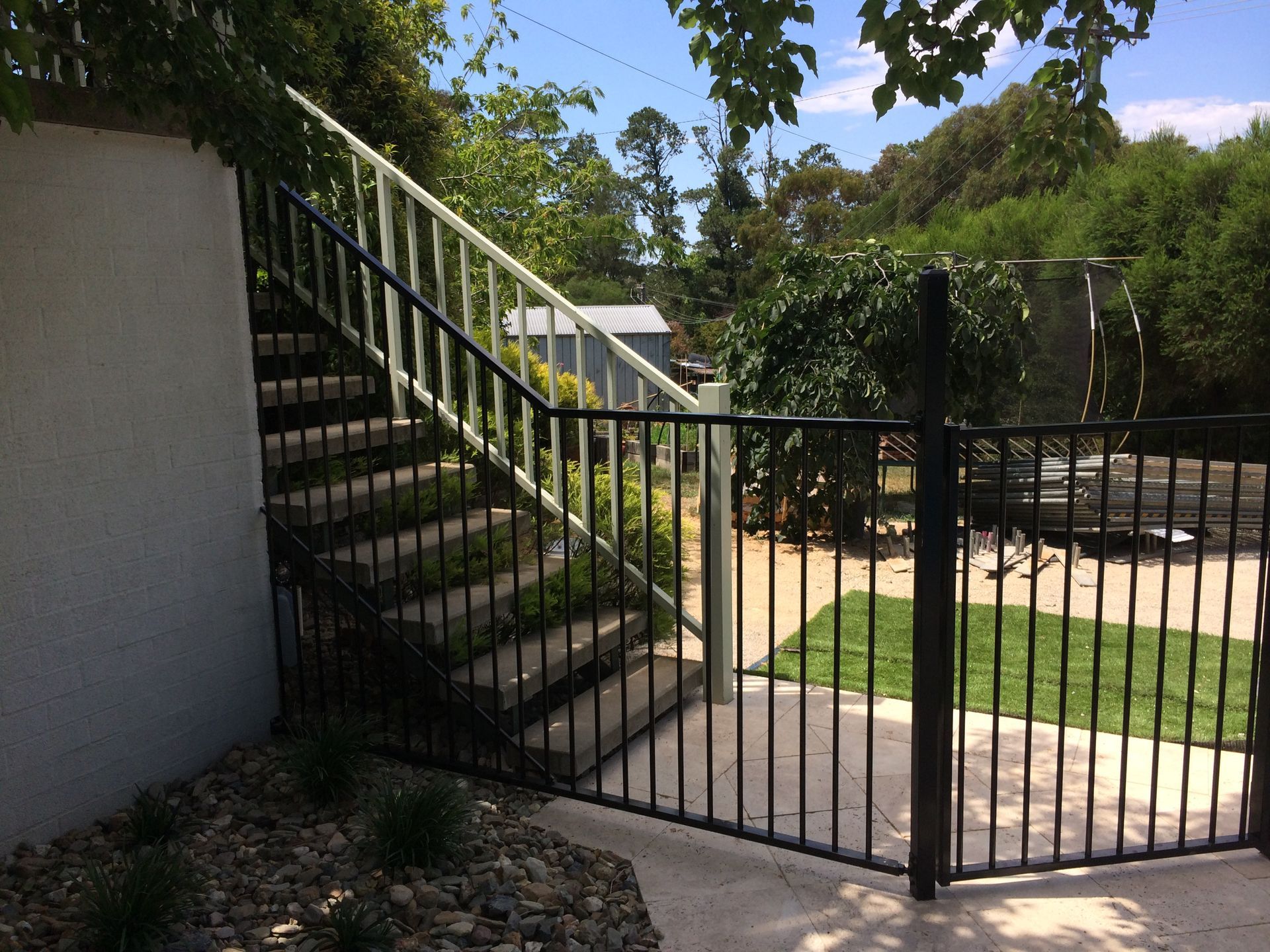Black Fencing Along Stairs— Capital Fencing in Charnwood, ACT