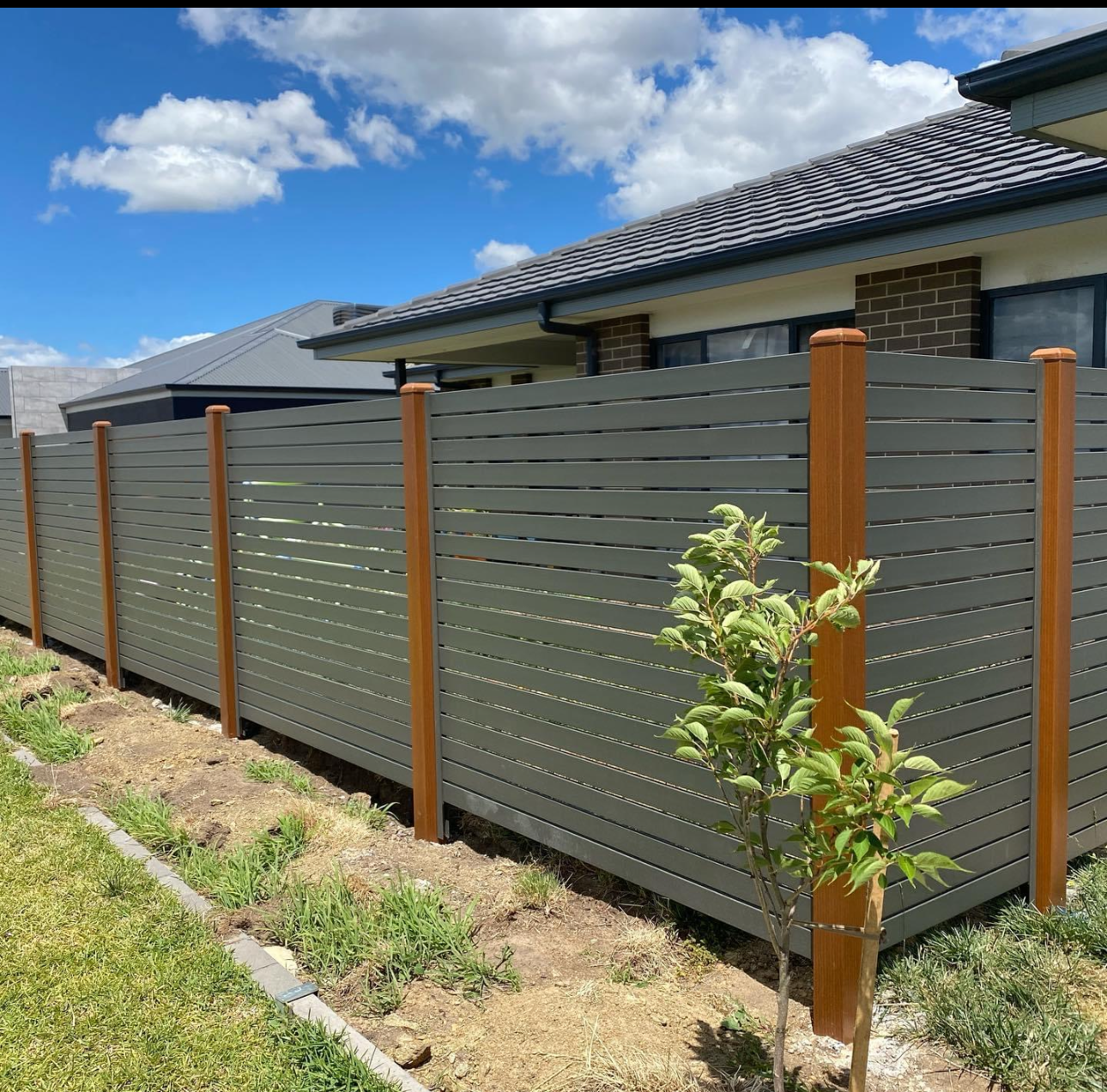 Section of Grey Slat Fencing  — Capital Fencing in Charnwood, ACT