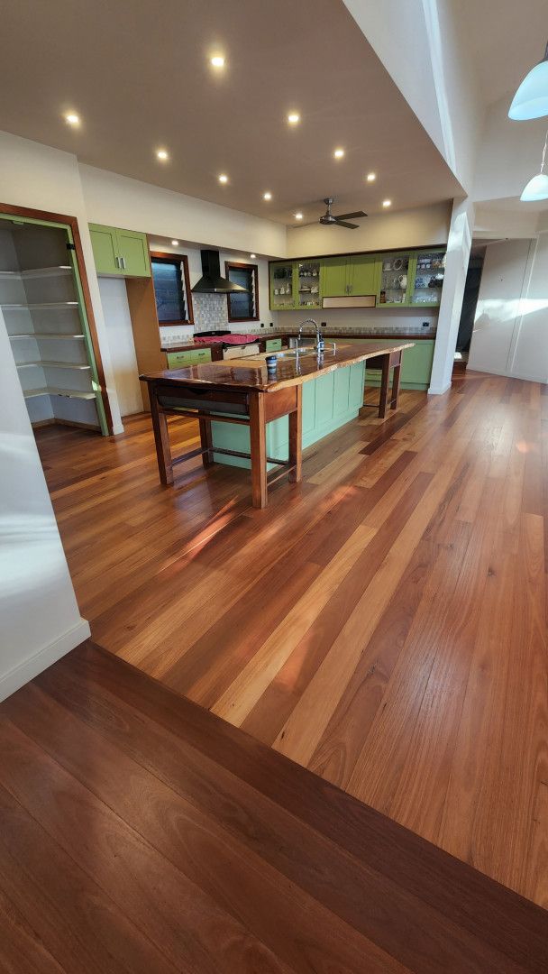 A Room With a Wooden Floor and a Window With a Shadow on the Floor — Shane Callinan Floor Sanding In Laurieton, NSW