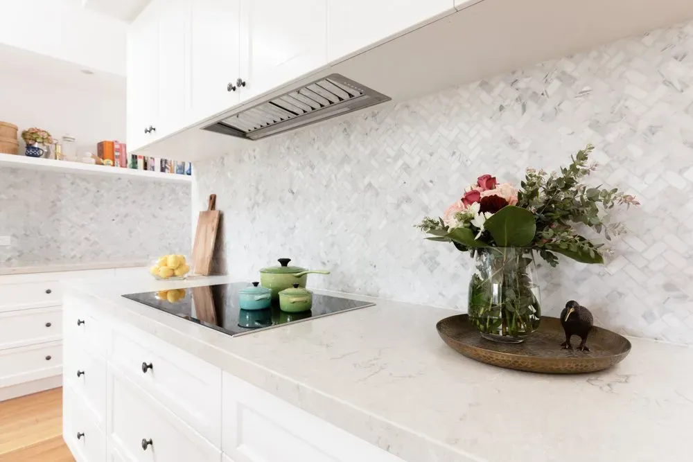 There is a Vase of Flowers on the Counter in the Kitchen — Shane Callinan Floor Sanding In Laurieton, NSW