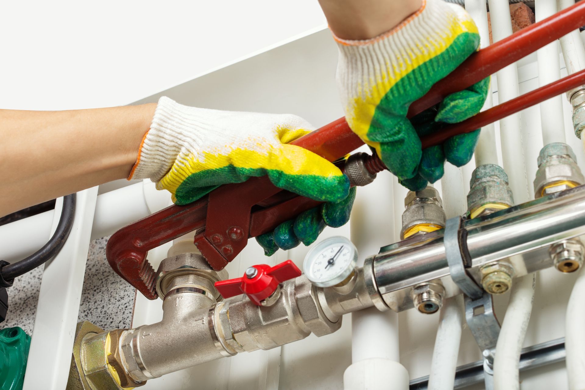 Person fixing a pipe.