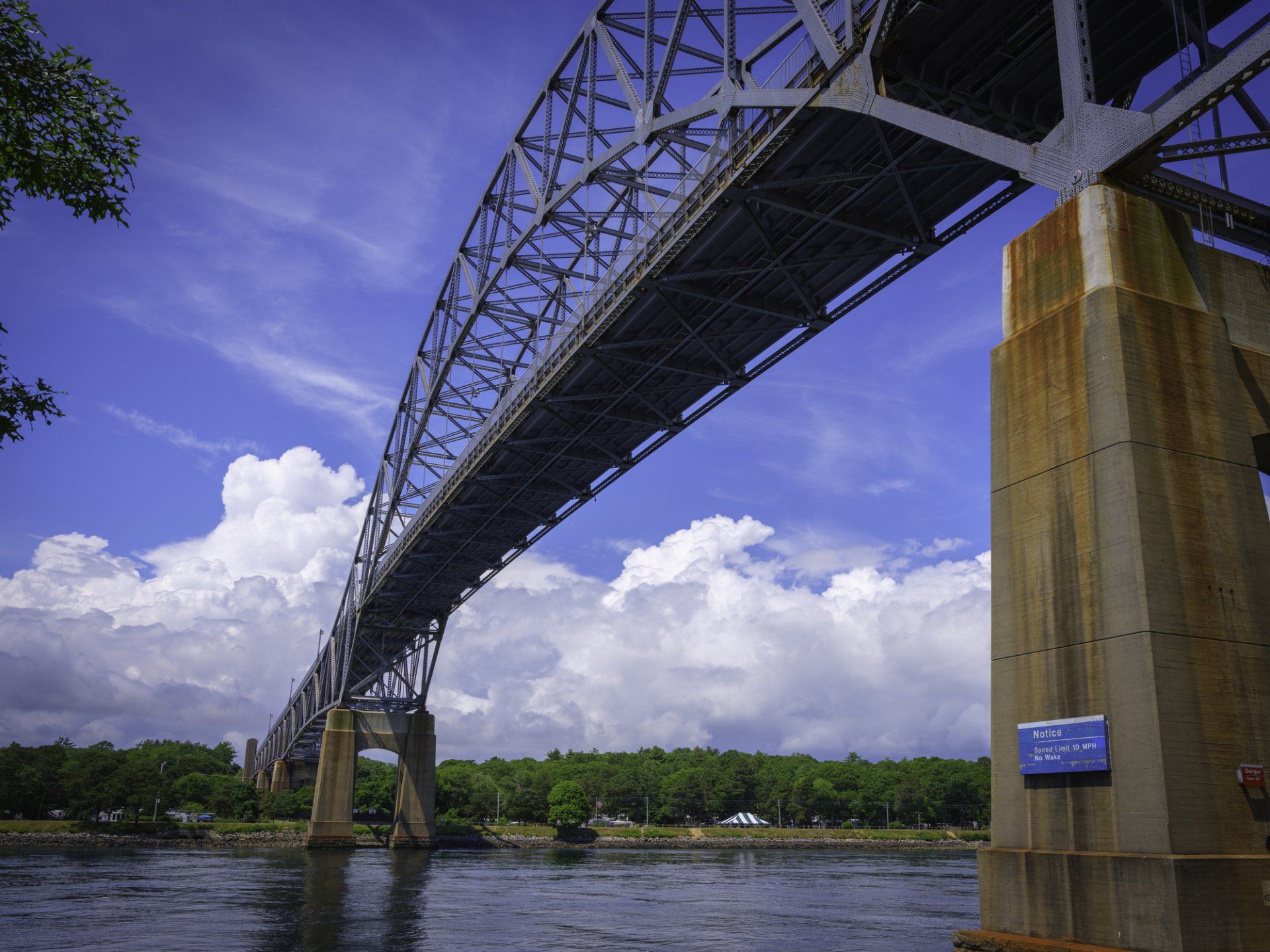 A bridge over a body of water with trees in the background - Baton Rouge, LA - Coastal Environments, Inc.