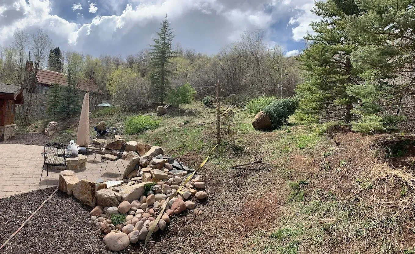 There is a fire pit in the middle of the yard.