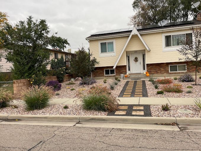 The front of a house with a walkway leading to it