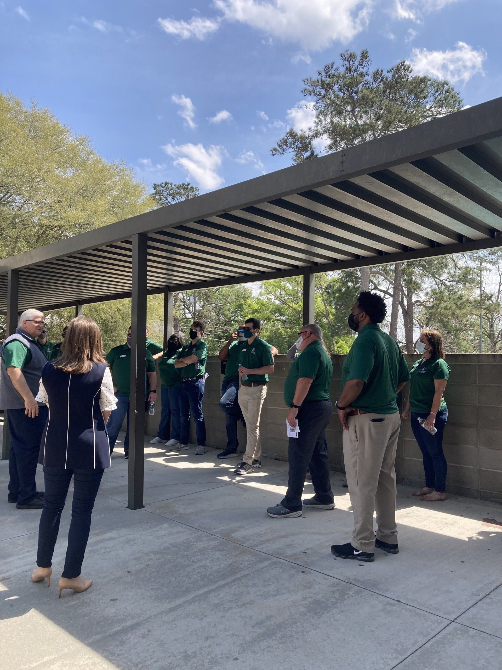 Outdoor covered walkway and trees outside Boys & Girls Club building