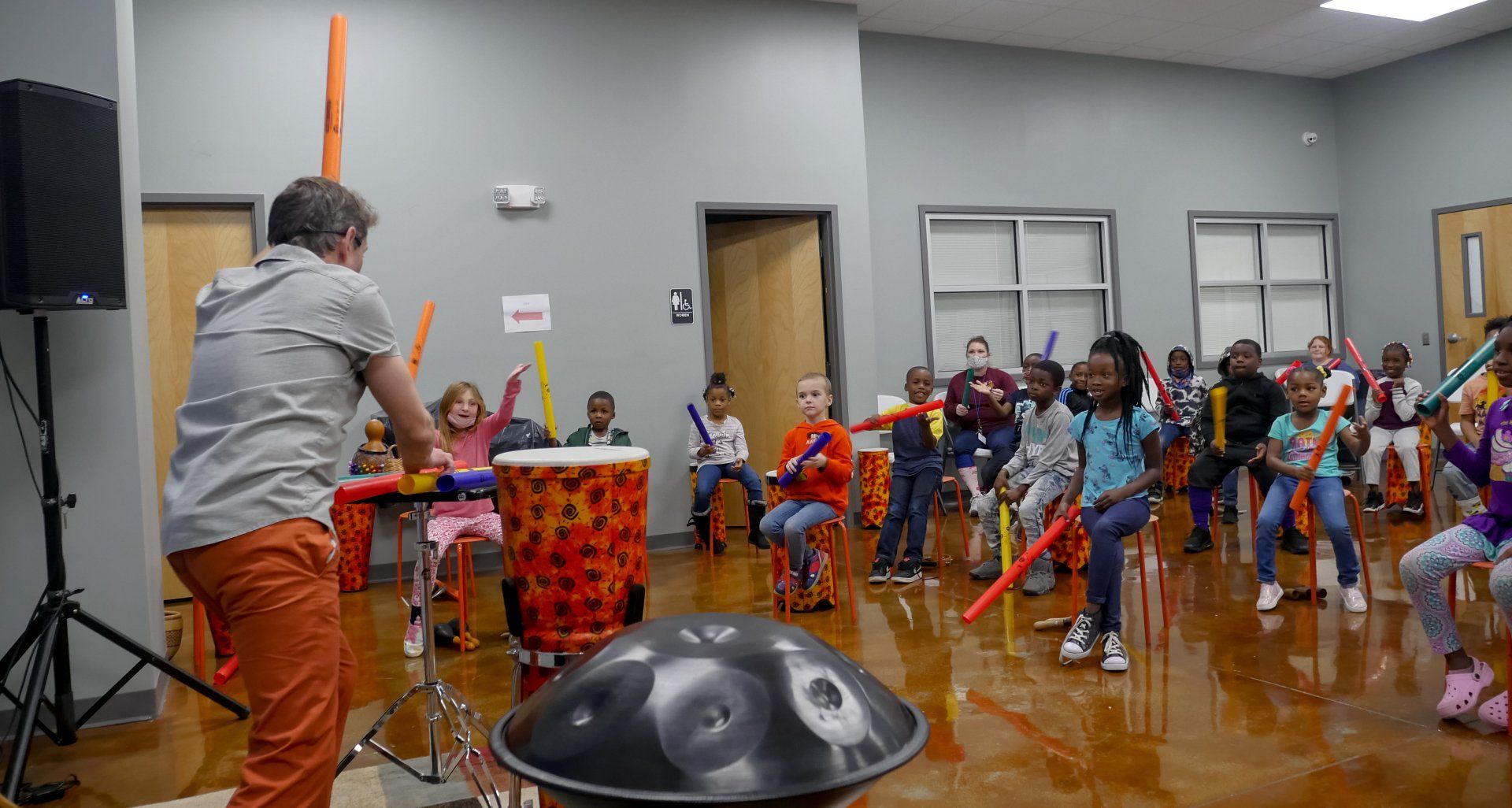 Children interacting with music lesson at the Boys & Girls Club