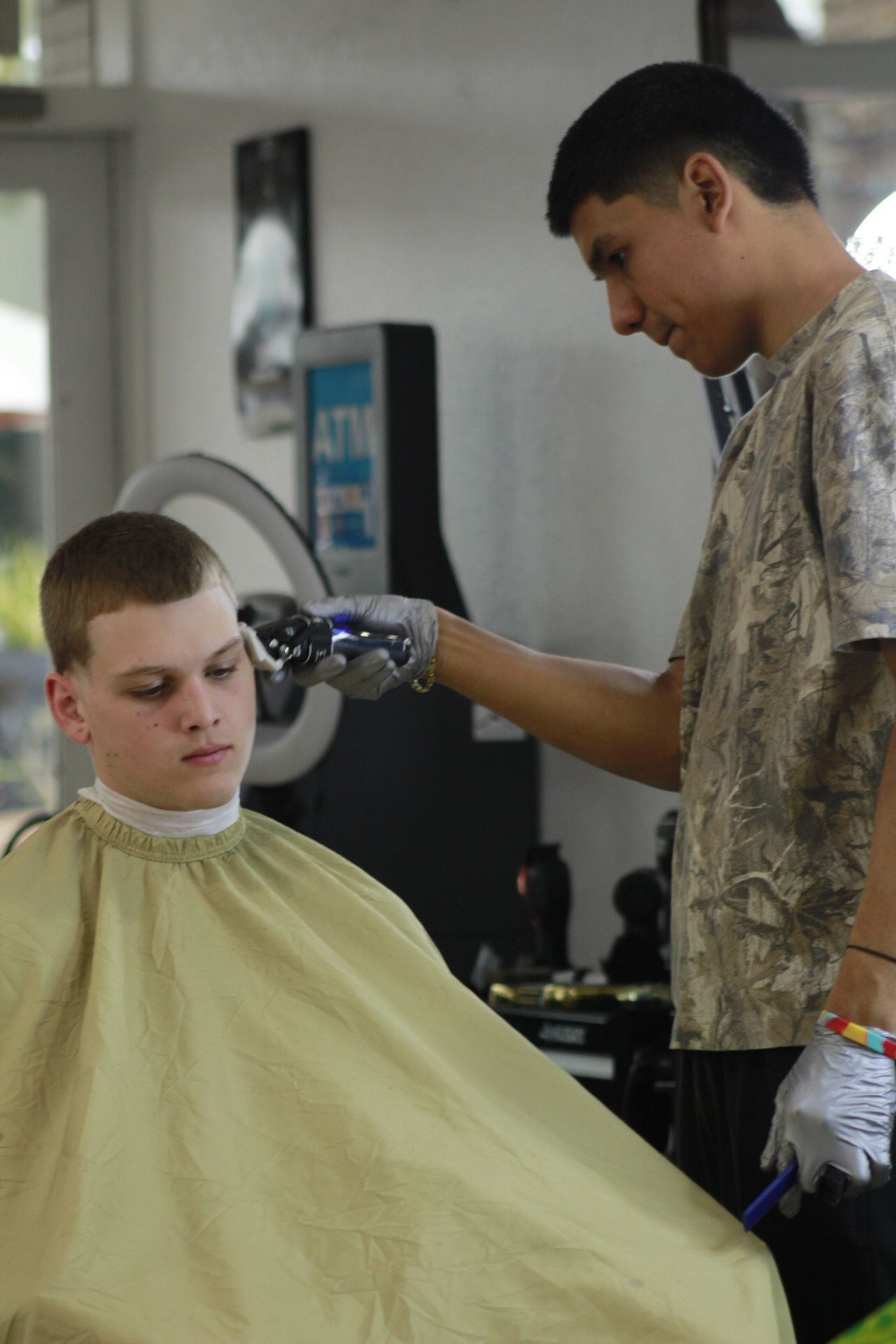 Man getting a beard trim with a straight razor
