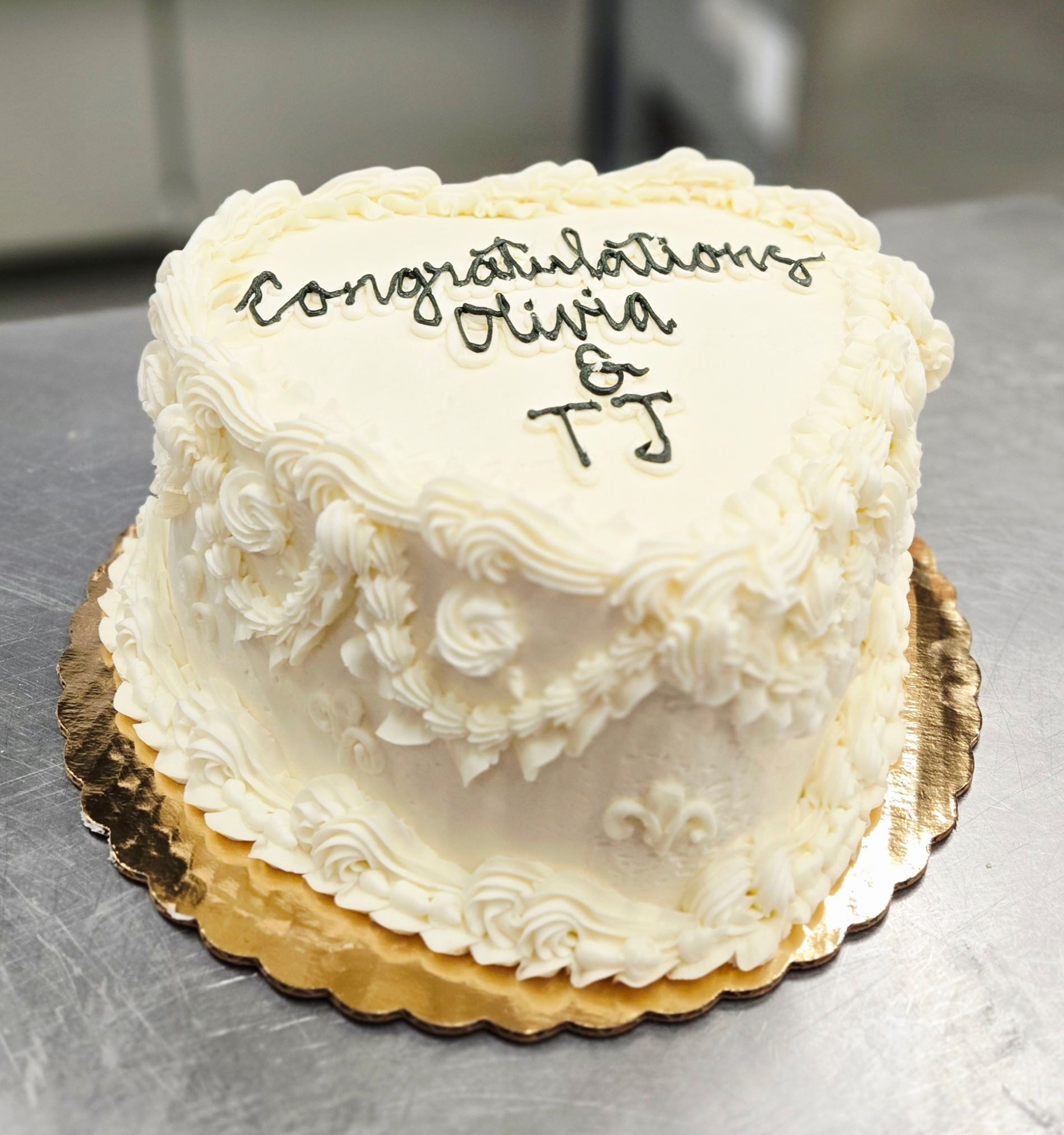 Heart-shaped cake with white frosting, 