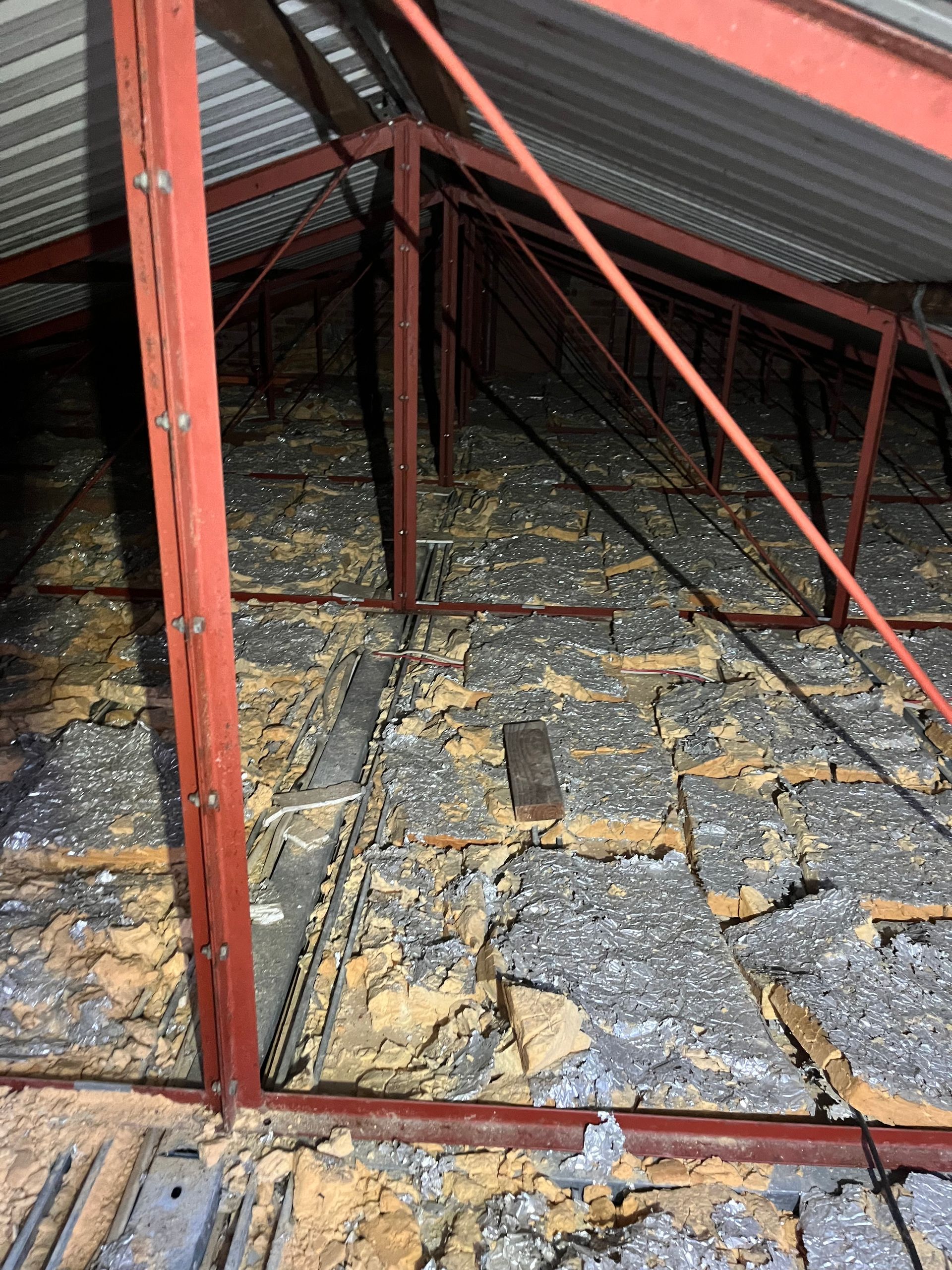 Image of old insualtion in roof prior to removal.
