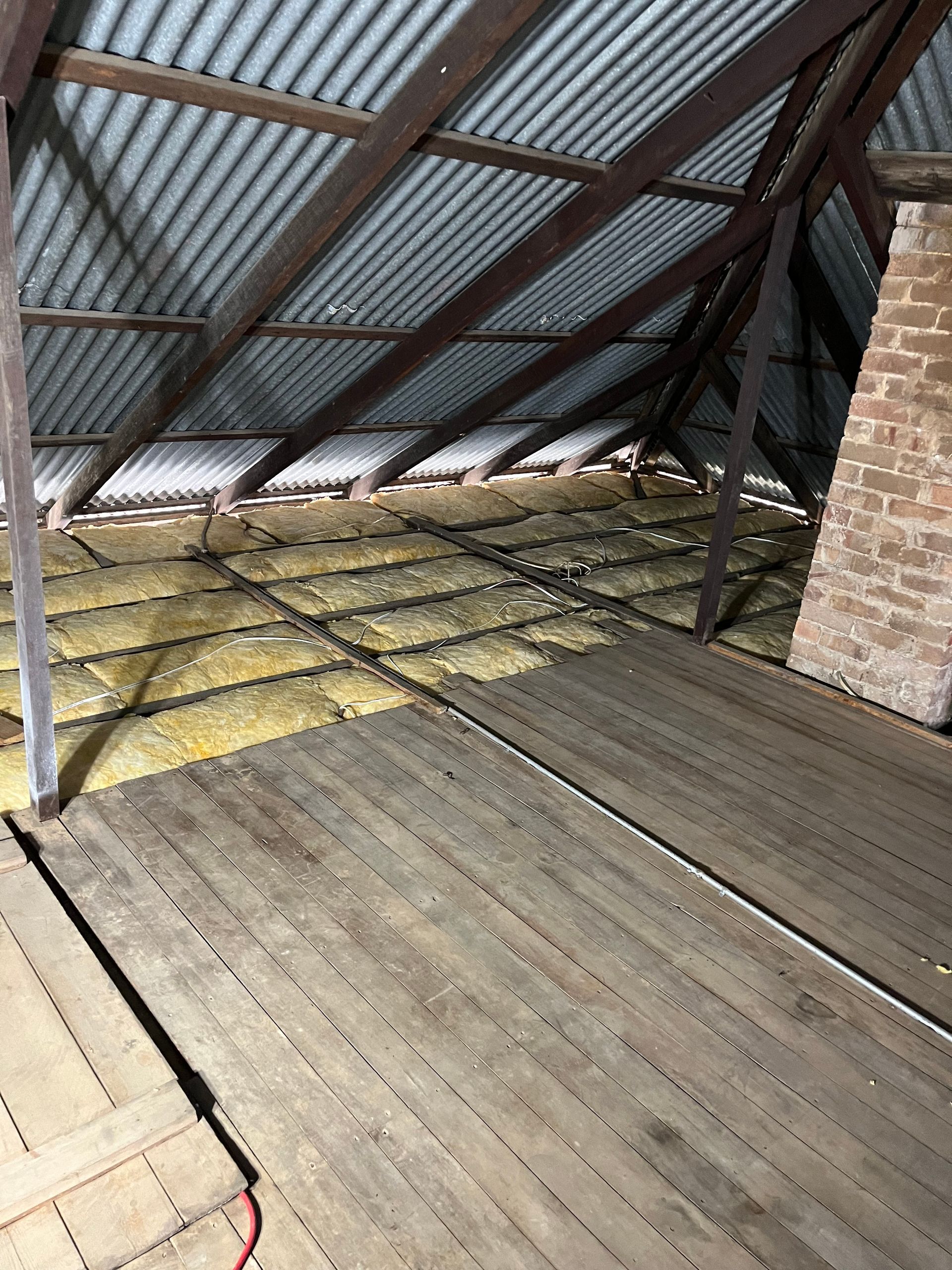 Completed insulation installation within roof cavuty.