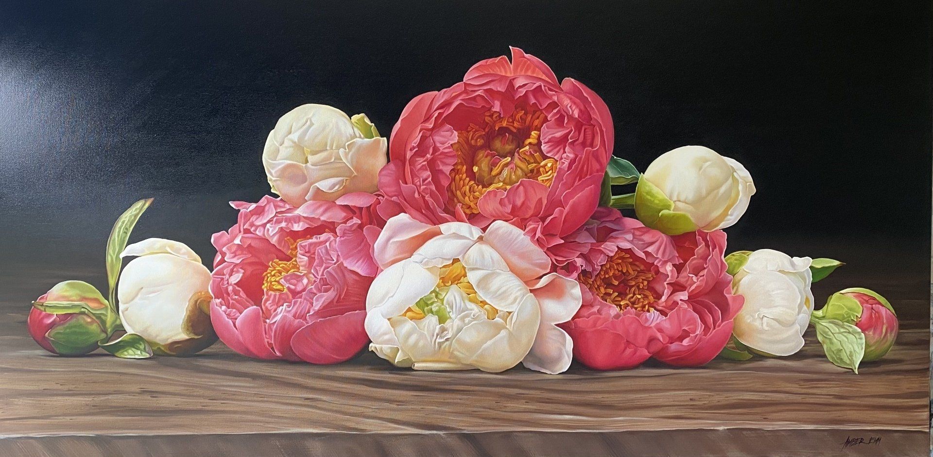 A painting of pink and white flowers on a wooden table.