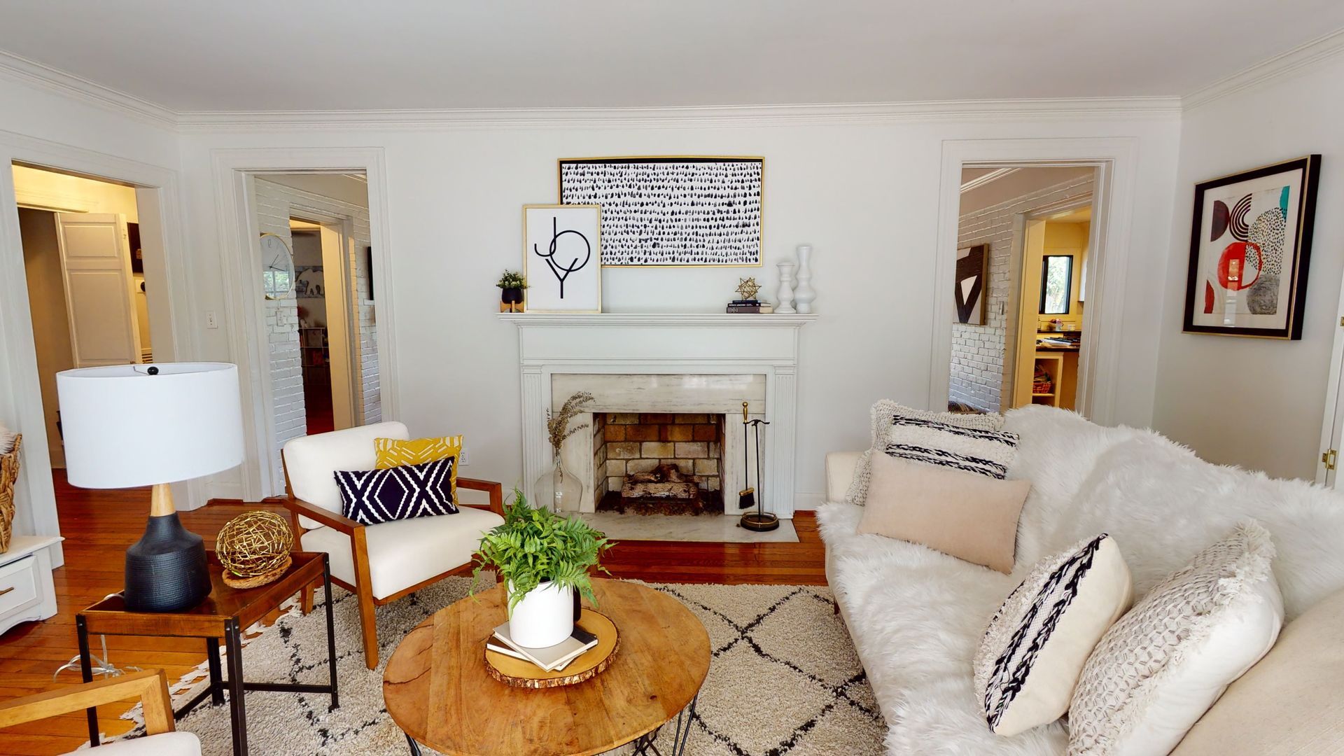 A living room with a ladder and a rug