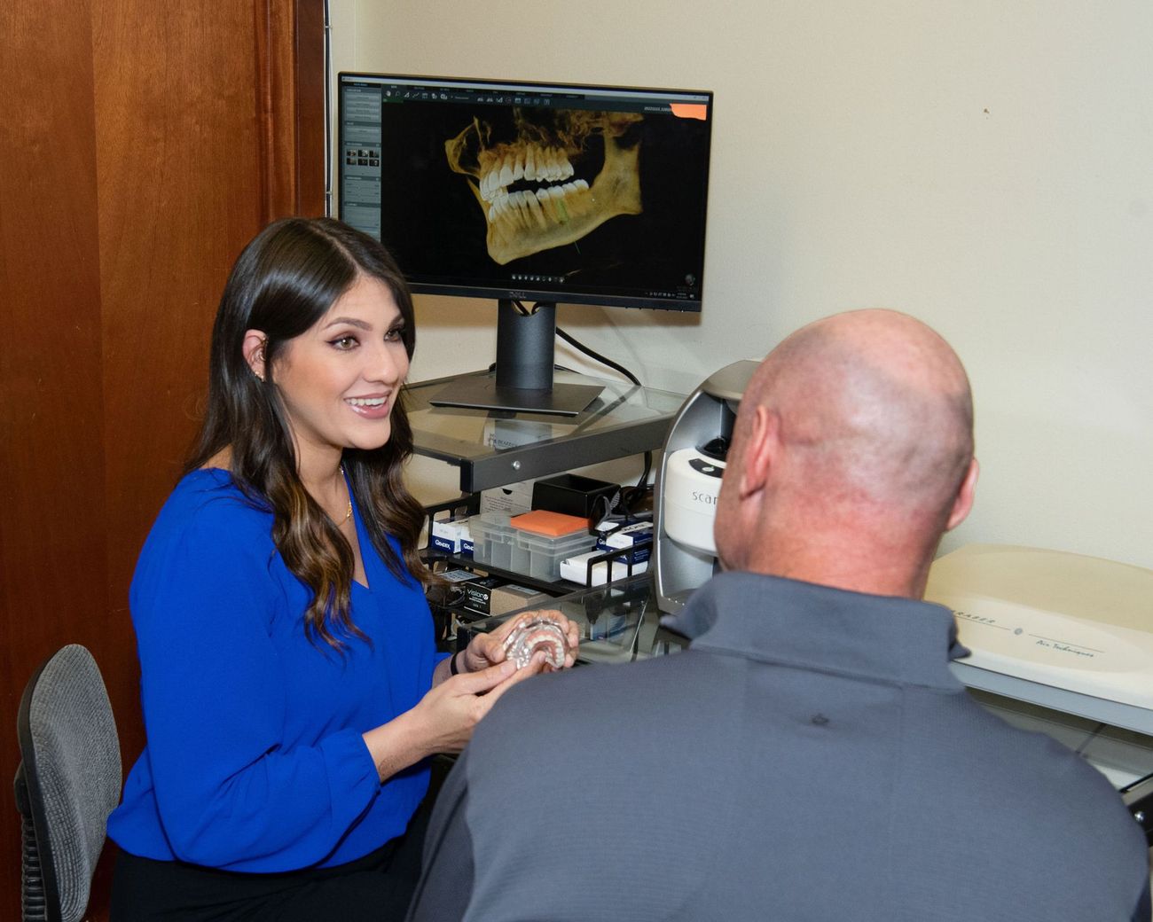 Dr. Michelle Torres Helping Patient | Dentists in Corpus Christi, TX