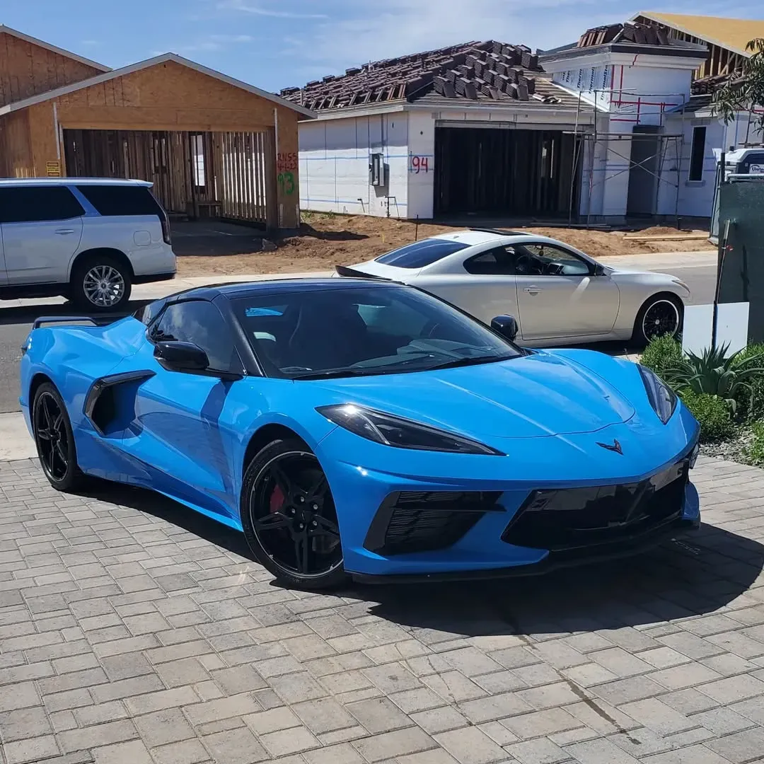 White BMW SUV parked in a driveway.