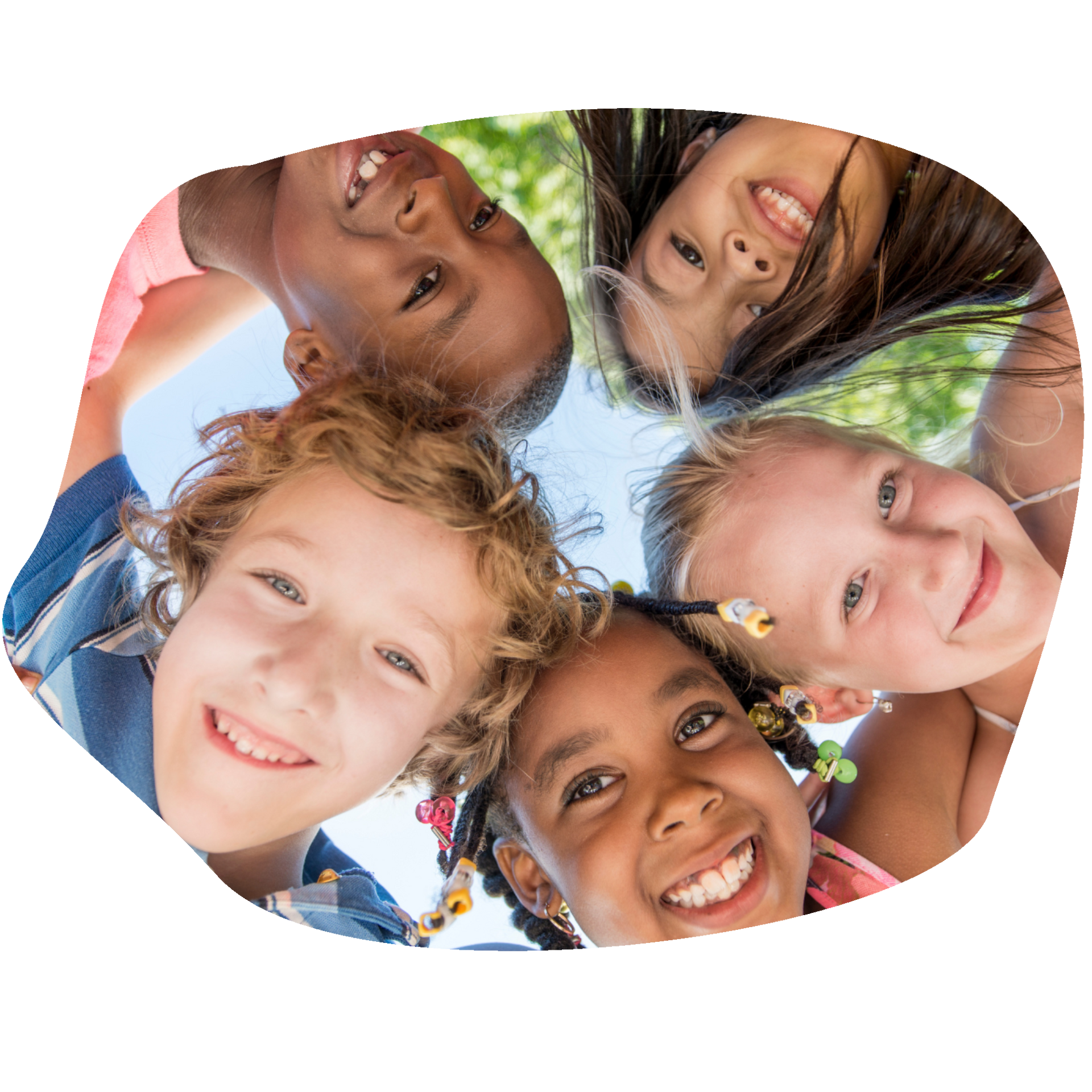 Five diverse children smiling and looking down at the camera, forming a circle.