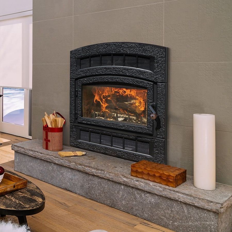A living room with a fireplace and a table