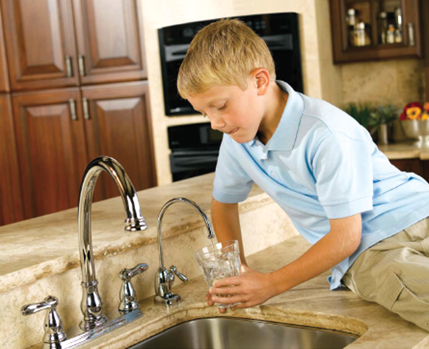Boy Pouring Water - Water Treatment in Jacksonville, FL