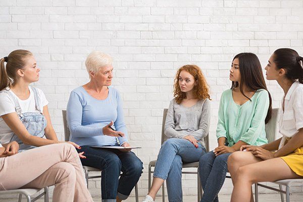 Psychologist Talking with Women During Support Group Meeting — Las Vegas, NV — ABC Therapy