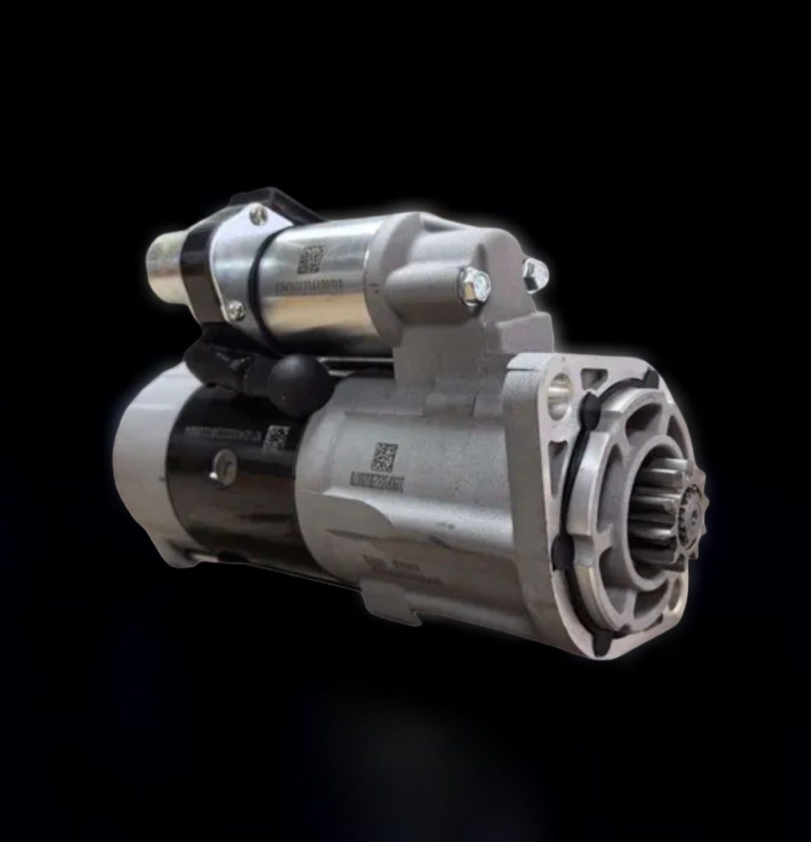 A gray and black automotive starter motor with a cylindrical solenoid, shown against a plain black background.