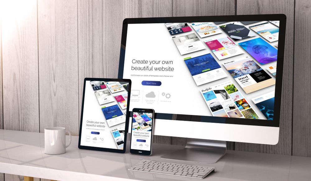 Desktop Computer, Tablet, and Smartphone Display a Website Builder — Tech Aid In Moffat Beach, QLD