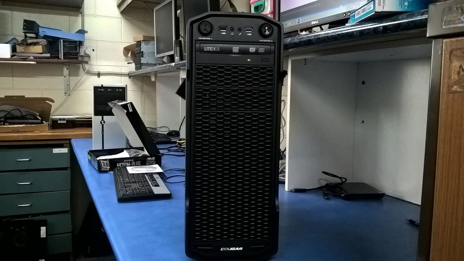 Black Computer Tower on a Blue Table in a Workshop Setting — Tech Aid In Bribie Island, QLD