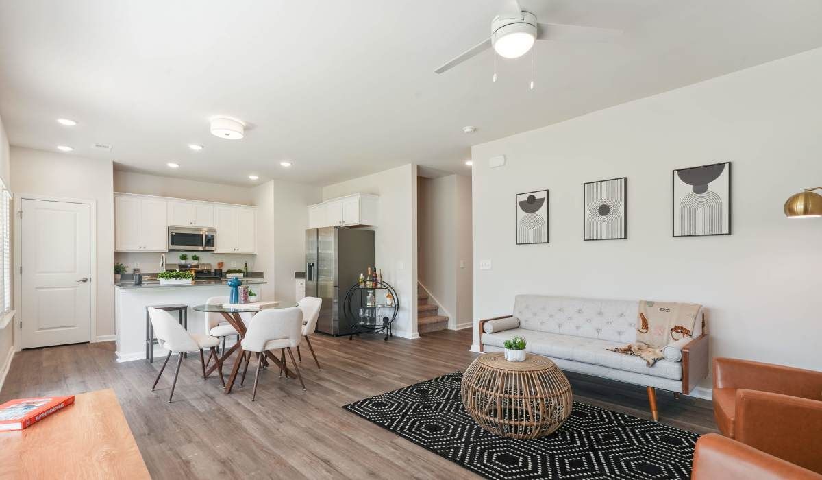 Living room with wood-style flooring, ceiling fan and a couch at Reve Park Ridge in Little River, South Carolina