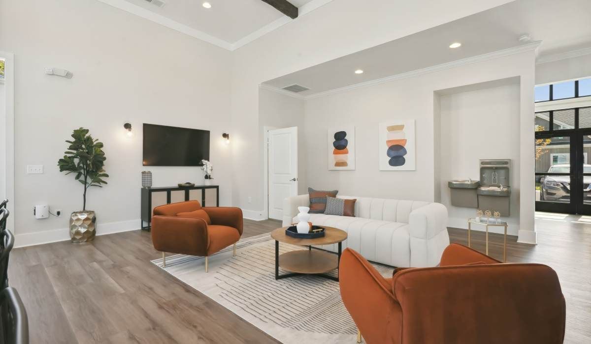 Spacious clubhouse with multiple seating and large TV at Reve Park Ridge in Little River, South Carolina