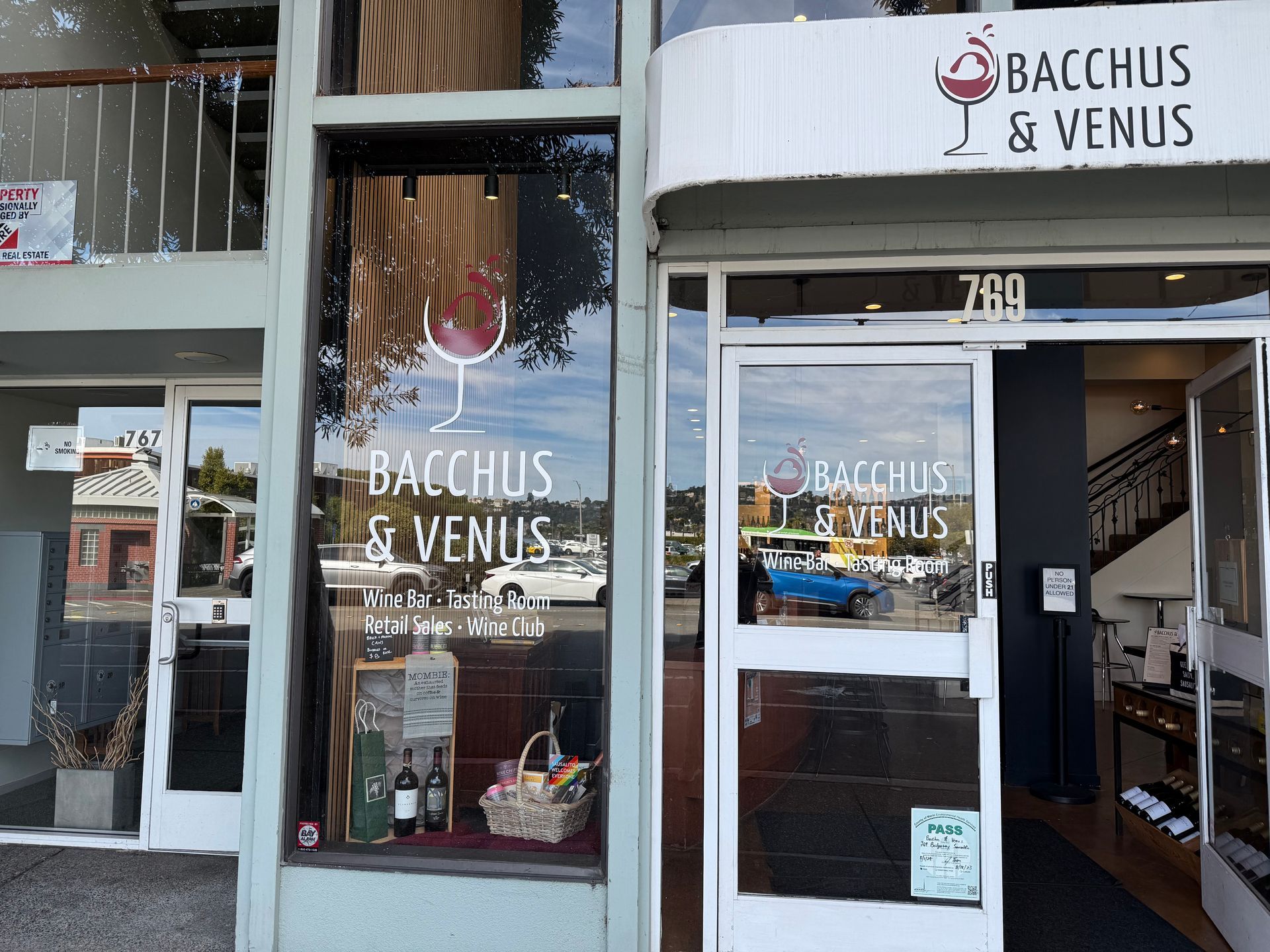 Bacchus and venus store front with a glass door