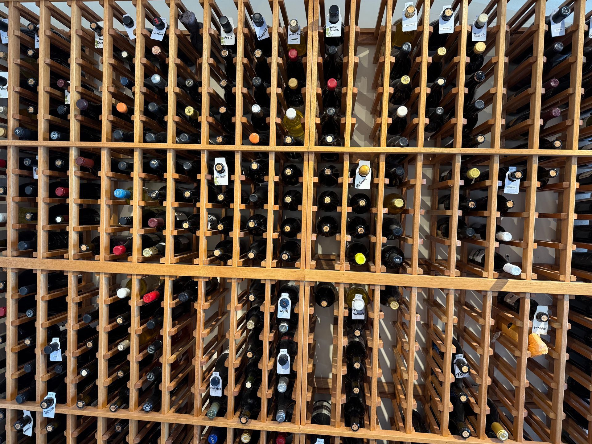 A wine rack filled with many bottles of wine