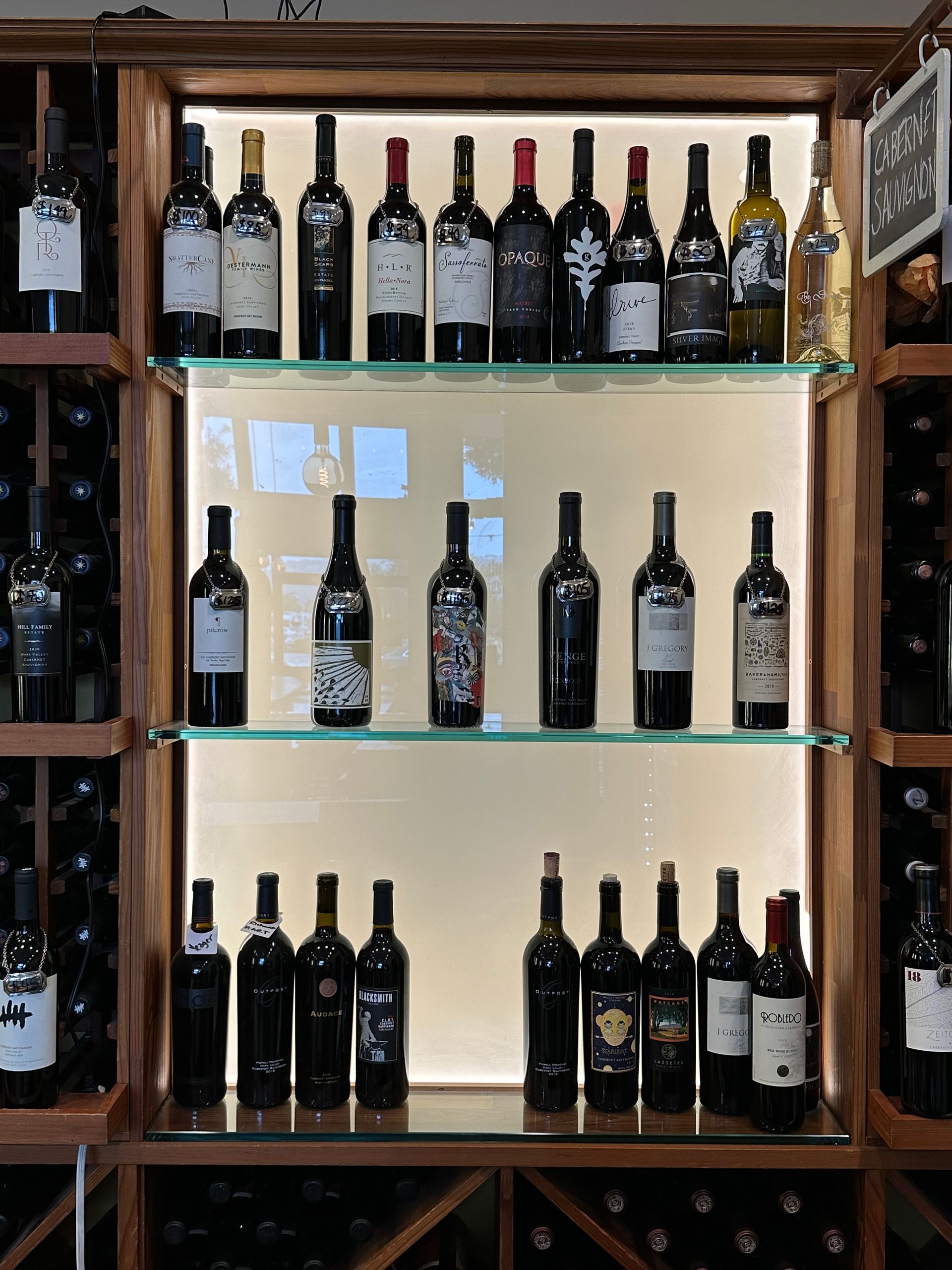 A wine cellar filled with lots of bottles of wine.