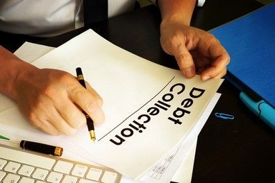 Close-up of businessman's hands giving money.