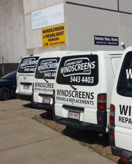 A Row of White Vans With Windscreens Written on the Back — Sunshine Coast Windscreens In Buderim, QLD