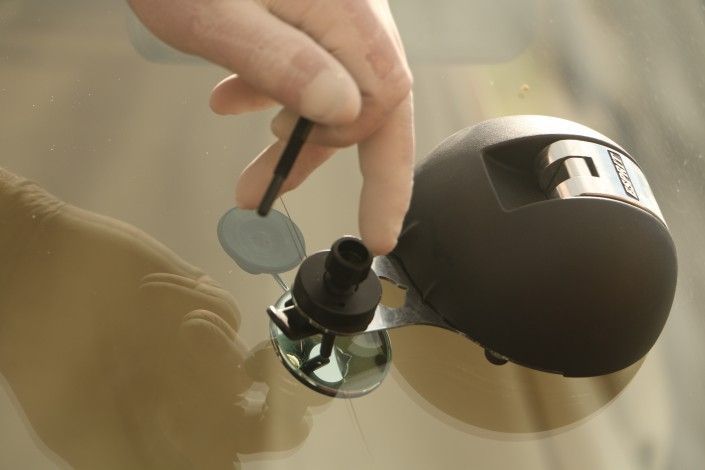 Person Repairing a Windshield Crack With a Tool — Sunshine Coast Windscreens In Buderim, QLD